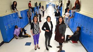 Students and teachers in hallway